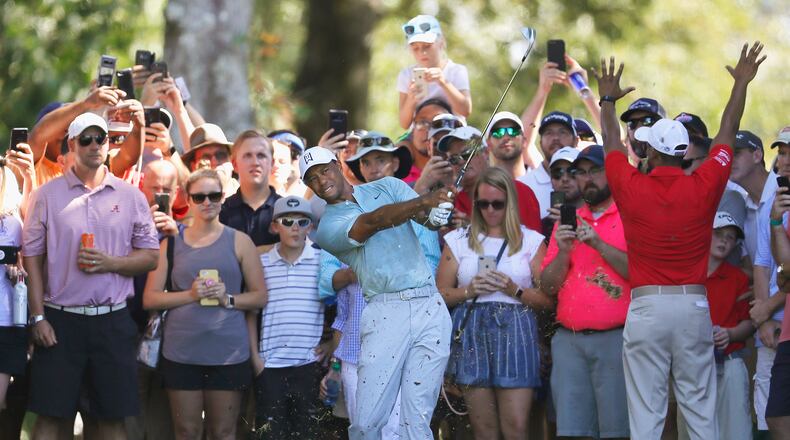 You have to admit, the guy draws a crowd, as here on the fifth hole Friday at the Tour Championship.  (Kevin C. Cox/Getty Images)