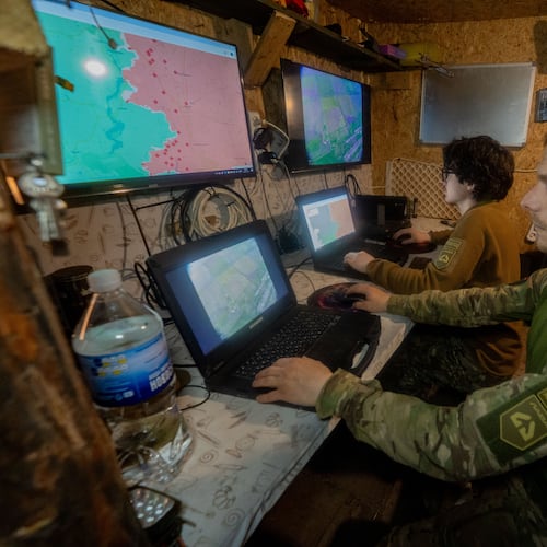 Ukrainian servicemen of Khartia brigade check the drone aerial view in the command centre Kharkiv region, Ukraine, Wednesday, May 20, 2026. (AP Photo/Andrii Marienko)