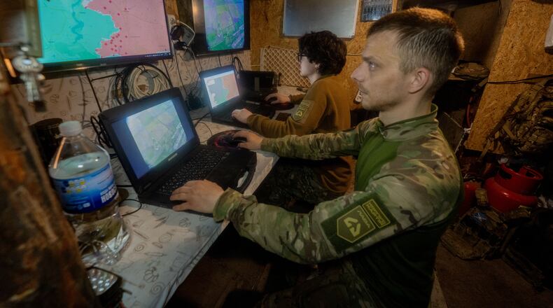 Ukrainian servicemen of Khartia brigade check the drone aerial view in the command centre Kharkiv region, Ukraine, Wednesday, May 20, 2026. (AP Photo/Andrii Marienko)