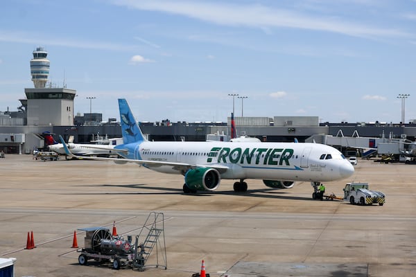 A Frontier Airline plane arrives at Hartsfield-Jackson Atlanta International Airport, Tuesday, May 5, 2026, in Atlanta. (Jason Getz/AJC)