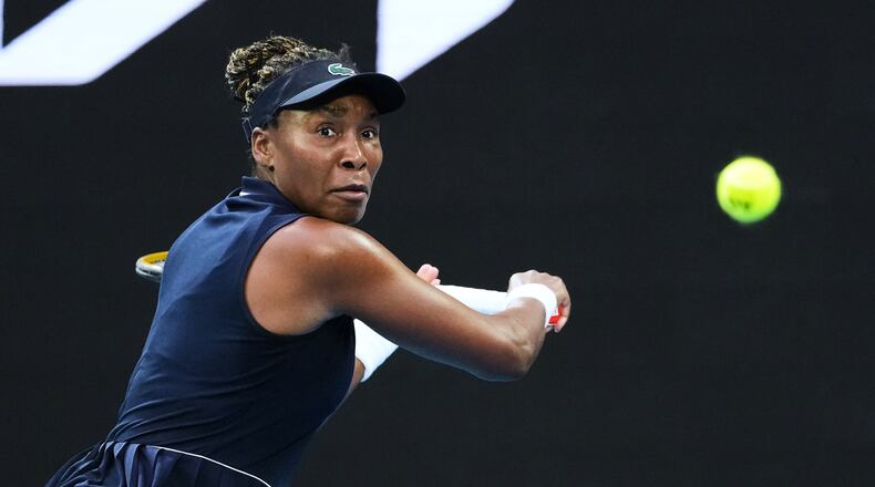FILE - Venus Williams, of the United States, plays a backhand return to Olga Danilovic, of Serbia, during their first round match at the Australian Open tennis championship in Melbourne, Australia, Jan. 18, 2026. (AP Photo/Aaron Favila, File)