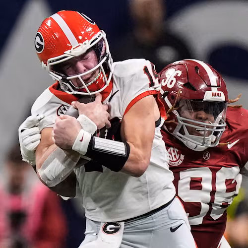 FILE Georgia quarterback Gunner Stockton (14) runs against Alabama during the second half of a Southeastern Conference championship NCAA college football game, Saturday, Dec. 6, 2025, in Atlanta. (AP Photo/Mike Stewart, File)
