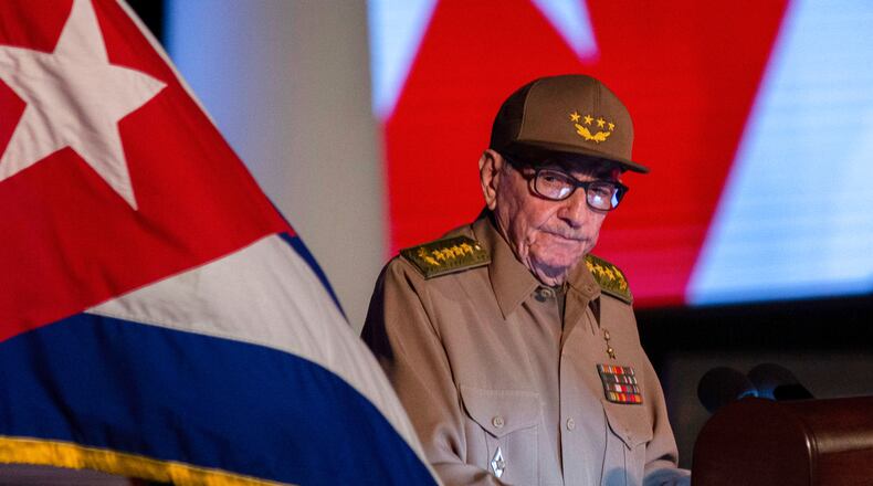 FILE - Former Cuban President Raul Castro looks at the Cuban flag during his speech at the event celebrating the 65th anniversary of the triumph of the revolution in Santiago, Cuba, Jan. 1, 2024. (AP Photo/Ismael Francisco, File)