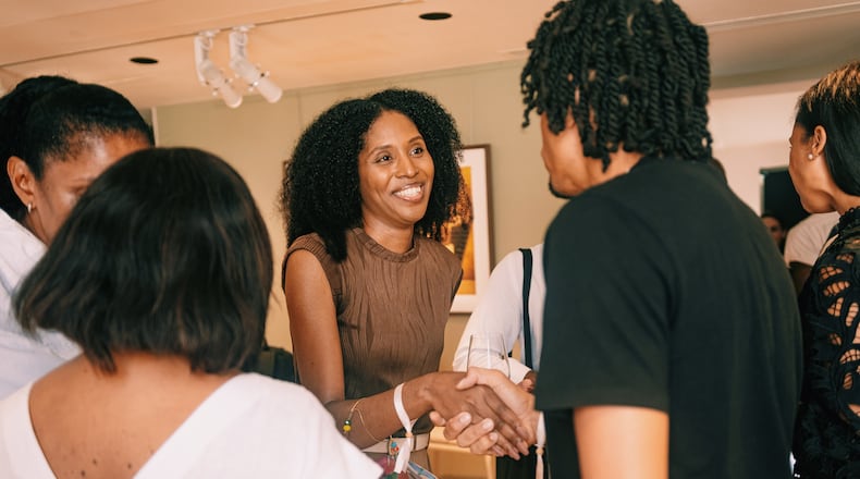 Maïré Bavarday-Rosa (center), co-founder and CEO of logistics hub ECOMSPACES, meets other attendees of Black Ambition events in Paris.
CREDIT: Jean-Bernard Matugas