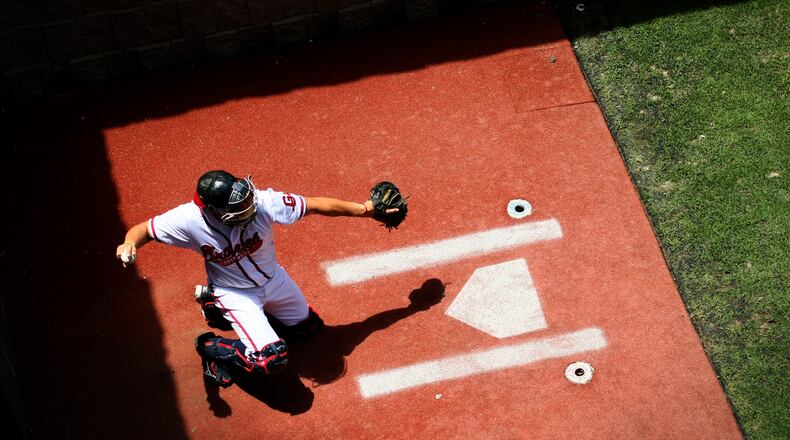 Gwinnett Braves catcher J.C. Boscan, age 32, catches for a relief pitcher in the bullpen during their game against the Buffalo Bisons at Coolray Field Thursday morning in Lawrenceville, Ga., May 10, 2012.