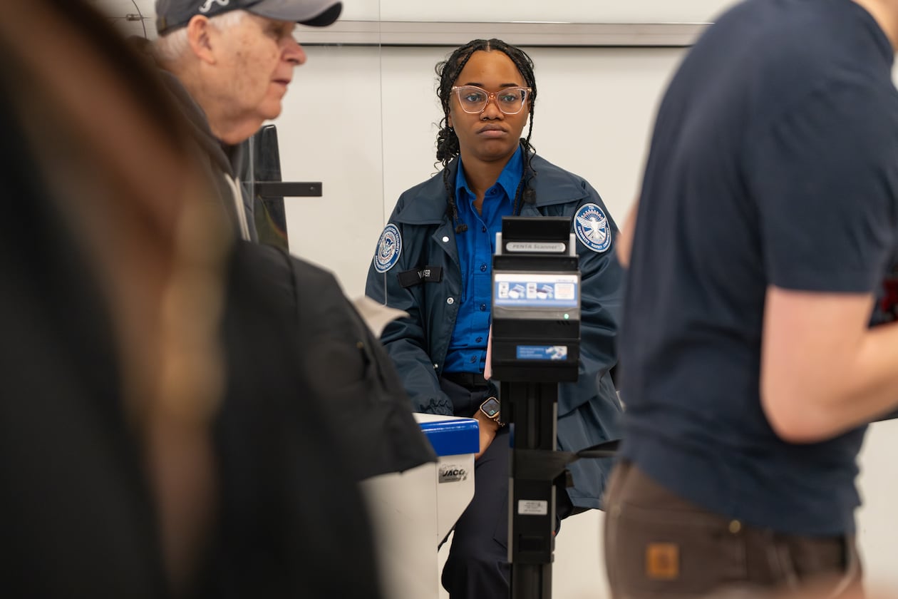 A TSA officer waits for the next traveler at her identification checkpoint at Hartsfield-Jackson Atlanta International Airport amid the ongoing partial government shutdown. Friday, March 27, 2026 (Ben Hendren for the AJC)