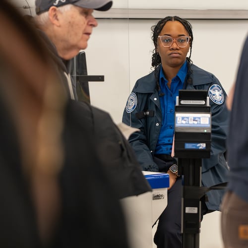A TSA officer waits for the next traveler at her identification checkpoint at Hartsfield-Jackson Atlanta International Airport amid the ongoing partial government shutdown. Friday, March 27, 2026 (Ben Hendren for the AJC)