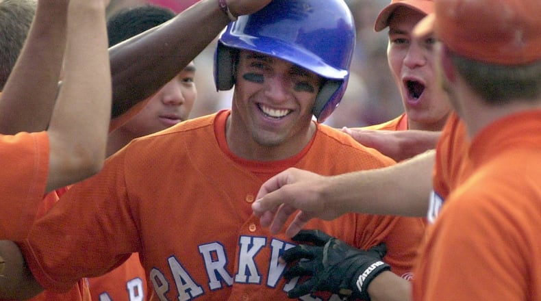 Parkview High School's Jeff Francoeur (center) is celebrated by teammates at a 7th inning homer run in the first game of the 2002 Georgia State AAAAA baseball championship series against Lassiter. Parkview won 5-4.