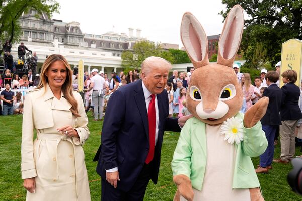 President Donald Trump and first lady Melania Trump, stand with the Easter bunny as they participate in the White House Easter Egg Roll on the South Lawn of the White House, Monday, April 21, 2025, in Washington. (AP Photo/Mark Schiefelbein)