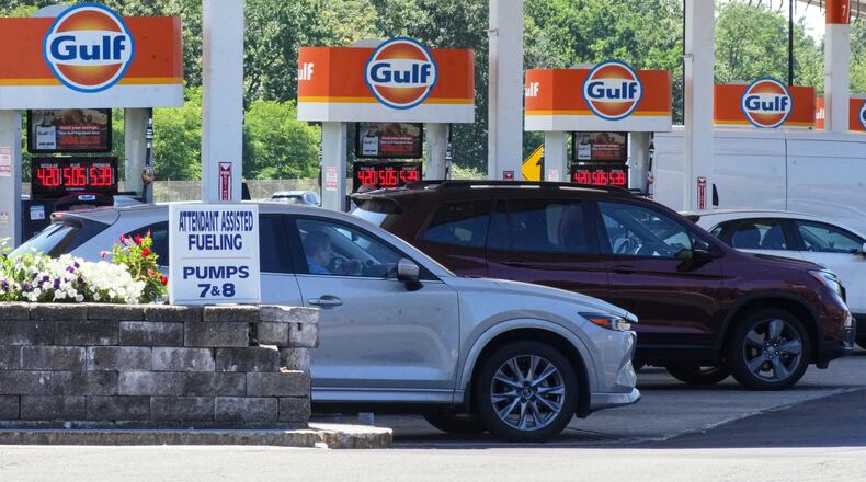 FILE - Cars line up at the pumps of a Gulf Oil station on the Massachusetts Turnpike near Boston, Sunday, July 19, 2026. (AP Photo/Gene J. Puskar, File)