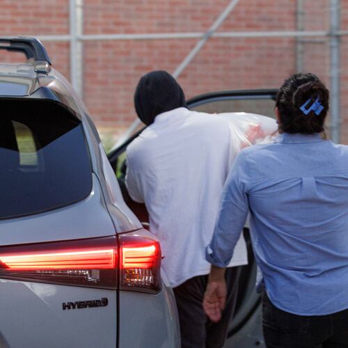 Immigration and Customs Enforcement officer Christian Castro gets into a car surrounded by news reporters moments after being released from the Carrizalez-Rucker Cameron County Detention Center in Brownsville, Texas on Thursday, Aug. 27, 2026. (AP Photo/Michael Gonzalez)