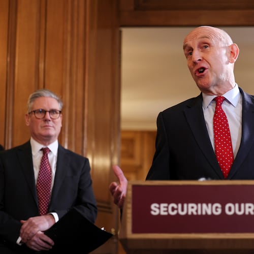 FILE - Britain's Prime Minister Keir Starmer, left, looks on as Defence Secretary John Healey speaks to apprentices and representatives in the defence industry, during a careers fair inside 10 Downing Street in central London, Monday March 3, 2025. (Adrian Dennis/Pool via AP, File)
