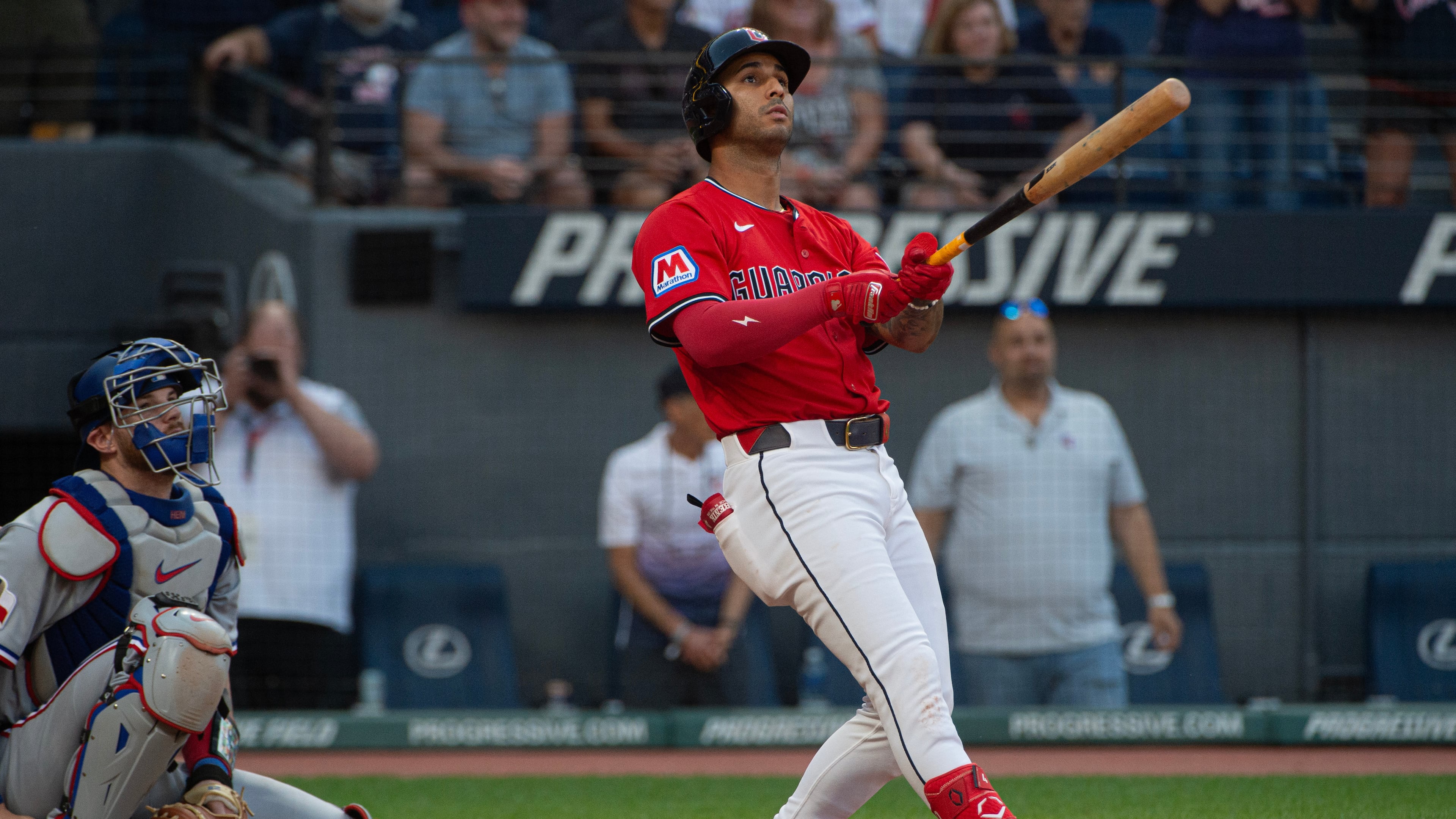 Cleveland Guardians' Brayan Rocchio, right, watches his walk off three-run home run off Texas Rangers relief pitcher Jose Corniell as Jonah Heim, left, watches during the tenth inning of a baseball game, Sunday, Sept. 28, 2025, in Cleveland. (AP Photo/Phil Long)