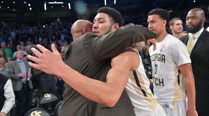 Georgia Tech guard Josh Heath embraces his father Stan, a Boston College assistant coach, after the Yellow Jackets’ win over the Eagles at McCamish Pavilion on Feb. 11. (Hyosub Shin/AJC)