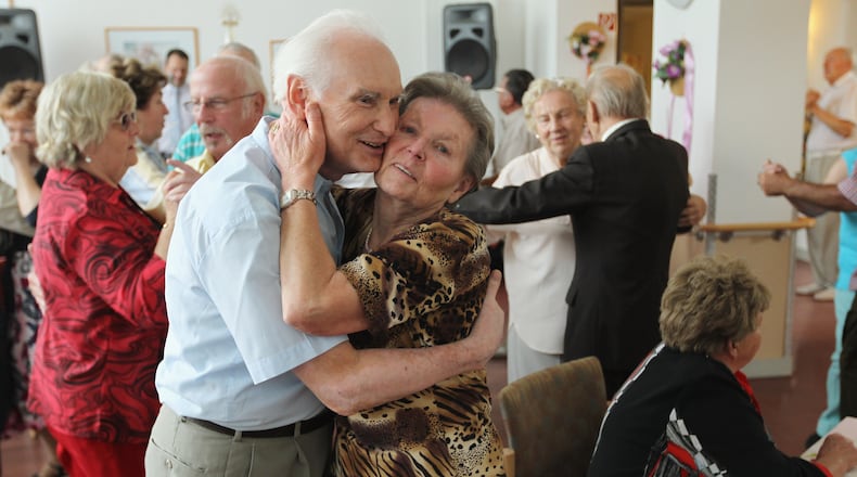 BERLIN, GERMANY - AUGUST 30: An elderly couple embrace while dancing during an afternoon get-together in the community room of the Sewanstrasse senior care home in Lichtenberg district on August 30, 2011 in Berlin, Germany. (Photo by Sean Gallup/Getty Images)