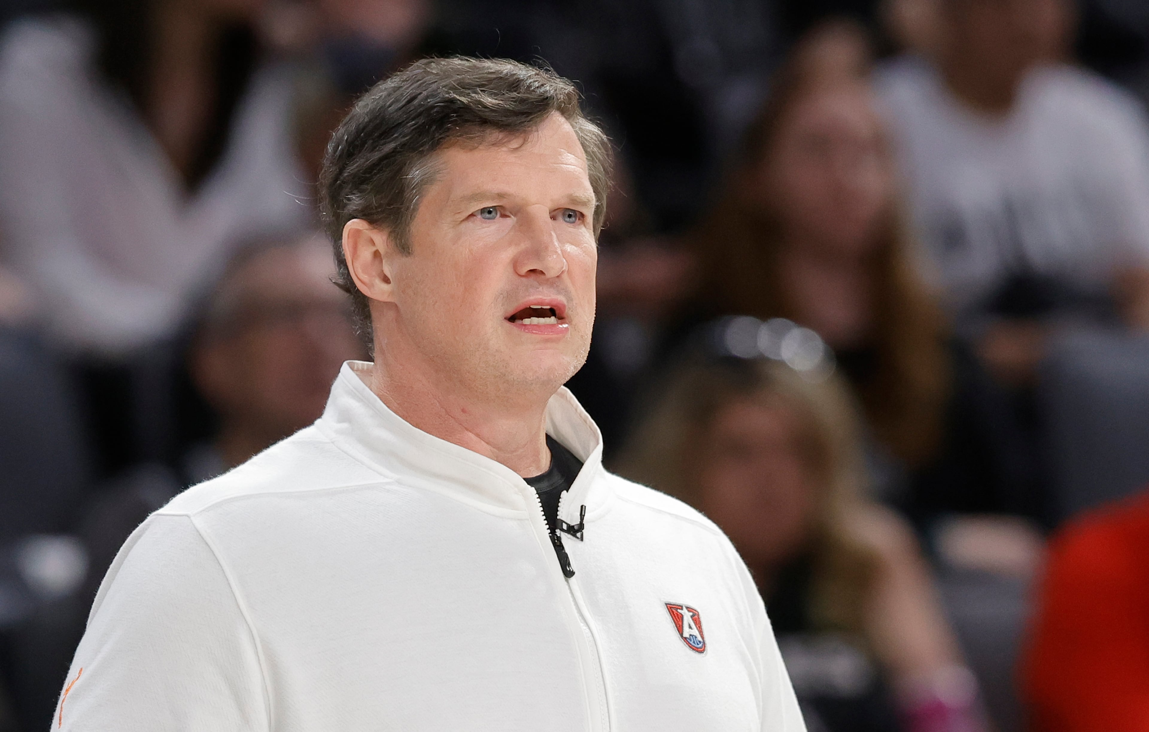 Dream head coach Karl Smesko watches his team play the Las Vegas Aces on Tuesday, July 22, 2025, in Las Vegas. Under the first-year coach, the Dream went 5-2 in May and climbed into sixth in title odds at +4950, according to Sports Betting Dime. (Steve Marcus/Las Vegas Sun via AP)