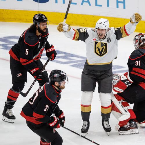Vegas Golden Knights' Pavel Dorofeyev (16) celebrates between Carolina Hurricanes' Jalen Chatfield (5), Alexander Nikishin (21), and goaltender Frederik Andersen (31) after a goal in the second period of Game 1 of the NHL hockey Stanley Cup Final series in Raleigh, N.C., Tuesday, June 2, 2026. (AP Photo/Ben McKeown)