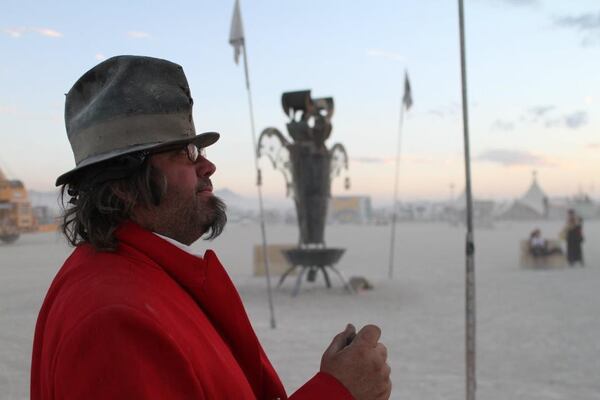 Smith stands on the Burning Man playa, the flat, ancient dry lake bed of the Black Rock Desert in northwest Nevada, (Courtesy of Charlie "Blackcat" Smith)