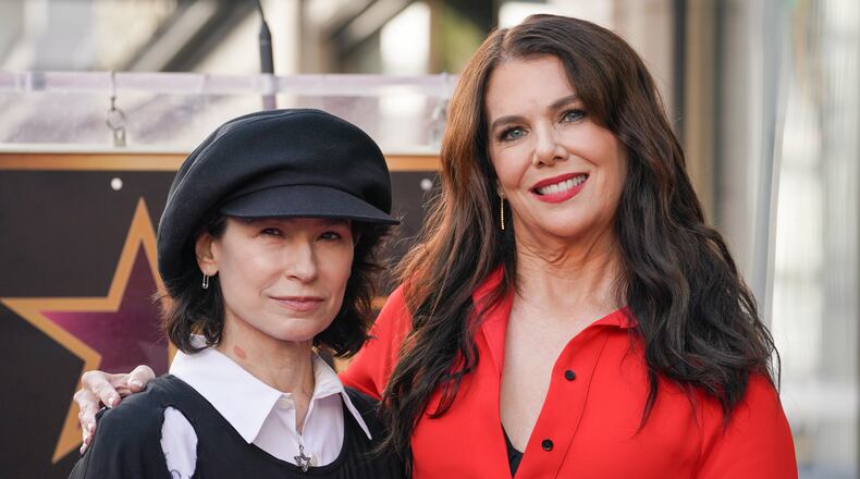 FILE - Amy Sherman-Palladino, left, and Lauren Graham pose with Graham's new star during a ceremony on the Hollywood Walk of Fame, Friday, Oct. 3, 2025, in Los Angeles. (Photo by Jordan Strauss/Invision/AP, File)