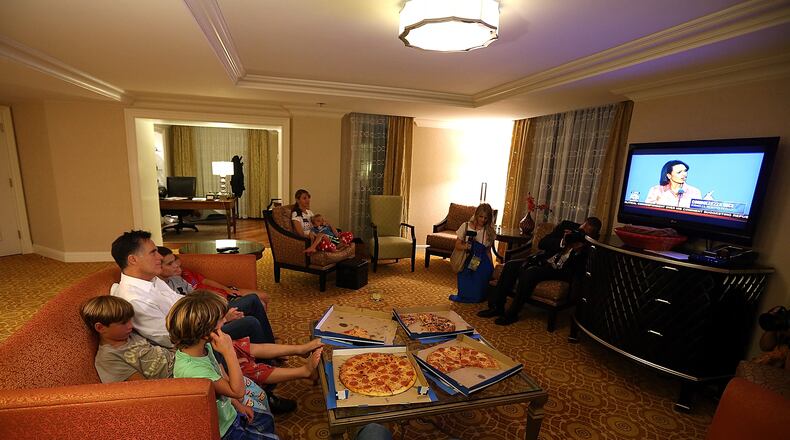 TAMPA, FL - AUGUST 29: Republican presidential candidate, former Massachusetts Gov. Mitt Romney (L) sits in his hotel room with his grandchildren as he watches a television broadcast of former Secretary of State Condoleezza Rice speaking during the Republican National Convention on August 29, 2012 in Tampa, Florida. As the Republican National Convention continues, Mitt Romney will travel to Indianapolis to Address the American Legion. (Photo by Justin Sullivan/Getty Images)