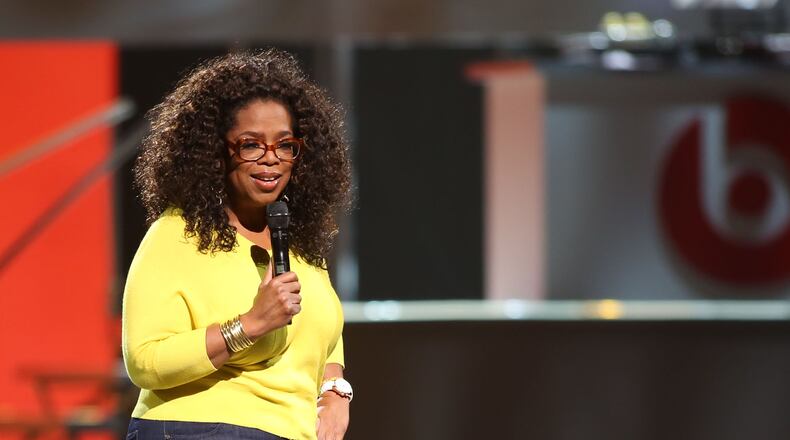 Oprah Winfrey talks to her audience before introducing Pastor Rob Bell, one of Time's most influential people in the world in 2011. (Akili-Casundria Ramsess/Special to the AJC)
