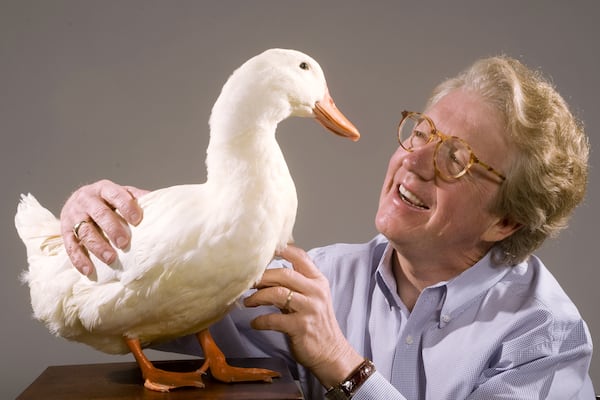 Aflac CEO Dan Amos in 2013 with the duck featured in the company's commercials. (Courtesy)