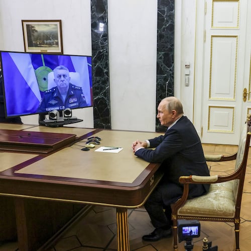 Russian Strategic Missile Forces chief, Col. Gen. Sergei Karakayev, left on the screen, reports to President Vladimir Putin on a successful test launch of the Sarmat intercontinental ballistic missile at the Kremlin in Moscow, Tuesday, May 12, 2026. (Mikhail Metzel/Sputnik, Kremlin Pool Photo via AP)