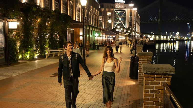 Nicholas Galitzine, left, and Anne Hatheway in “The Idea of You." They are in Savannah, which masquerades as a European city while the fictional band August Moon is on tour. (Alisha Wetherill/Prime Video/TNS)