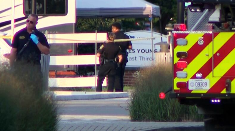 This image taken from video and provided by WTVQ shows officers at the scene of a shooting at Charles Young Park in Lexington, Ky., Saturday, Aug. 15, 2026. (WTVQ via AP)