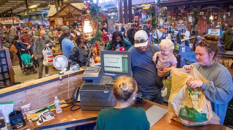 Customers line up at the checkout counter at the Bass Pro Shops near Lawrenceville on Saturday, November 13, 2021 STEVE SCHAEFER FOR THE ATLANTA JOURNAL-CONSTITUTION