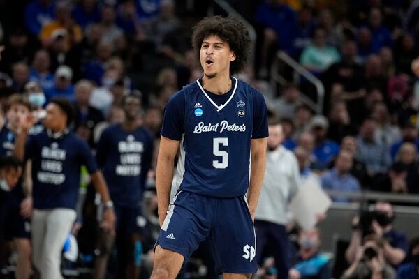 FILE - St. Peter's guard Daryl Banks III (5) celebrates after making a 3-point basket during the first half of a college basketball game against Kentucky in the first round of the NCAA tournament, March 17, 2022, in Indianapolis. (AP Photo/Darron Cummings, File)