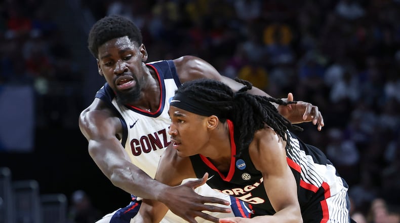 Georgia guard Silas Demary Jr. (5) tries to get past Gonzaga forward Graham Ike, left, during the second half in the first round of the NCAA college basketball tournament, Thursday, March 20, 2025, in Wichita, Kan. (AP Photo/Travis Heying)