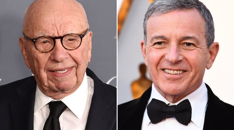 This combination photo shows Fox News chairman and CEO Rupert Murdoch at the WSJ Magazine 2017 Innovator Awards in New York on Nov. 1, 2017, left, and Disney CEO Bob Iger at the Oscars in Los Angeles on March 4, 2018. Disney's $71.3 billion acquisition of Fox's entertainment assets is set to close around 12 a.m. EDT on Wednesday.