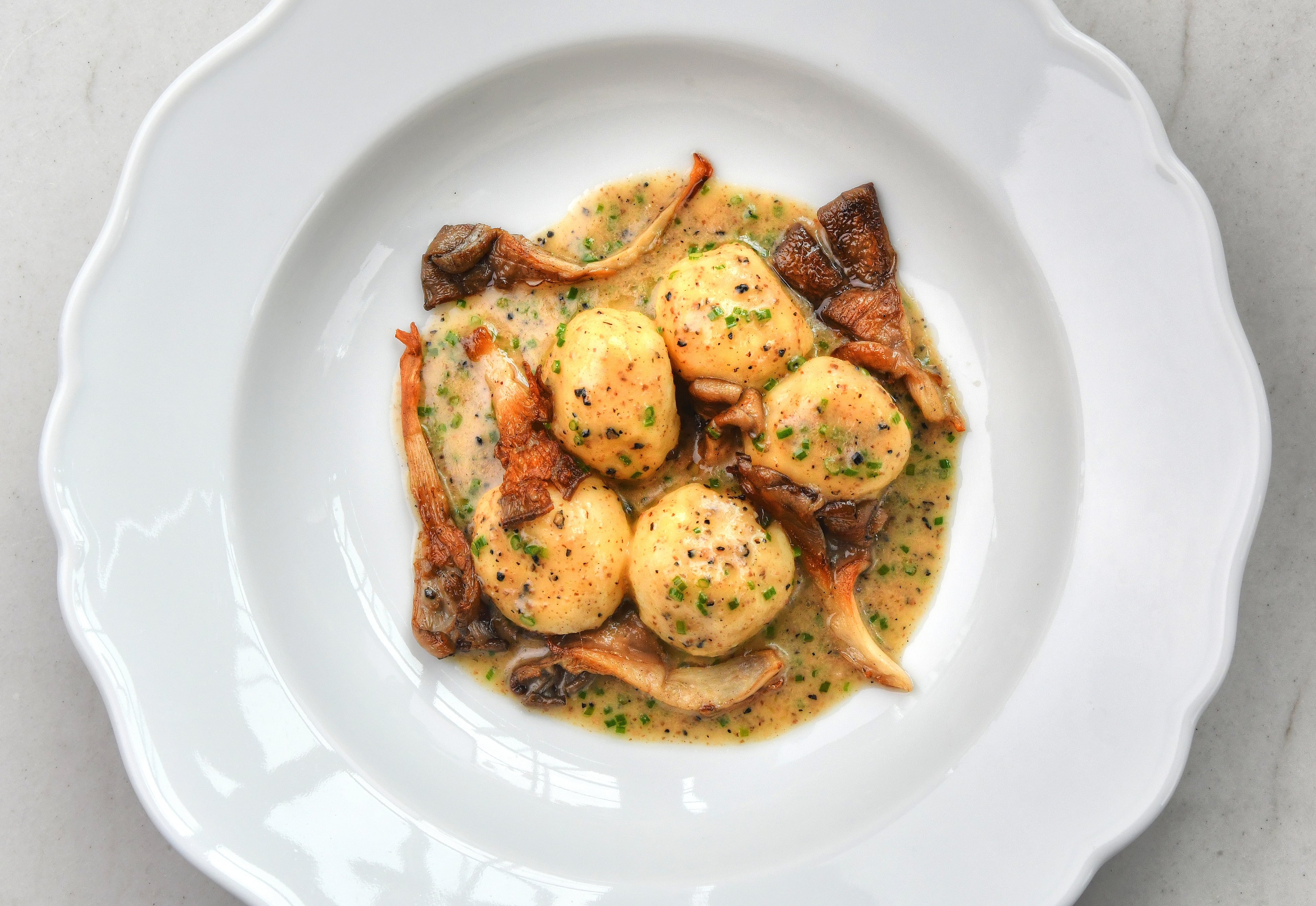 While the components may change, ricotta gnudi is a mainstay at Lucian Books and Wine. (Chris Hunt for the AJC)