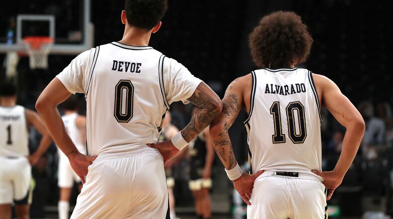 Georgia Tech team guards Jose Alvarado (10) and Michael Devoe (0) stand shoulder to shoulder on defense against Wake Forest Sunday, Jan. 3, 2021, at McCamish Pavilion in Atlanta. (Curtis Compton / Curtis.Compton@ajc.com)