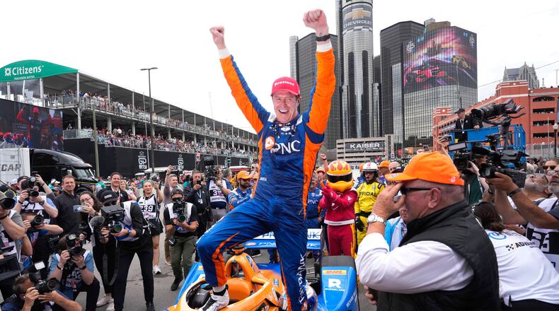 FILE - Scott Dixon celebrates winning the IndyCar Detroit Grand Prix auto race in Detroit, Sunday, June 2, 2024. (AP Photo/Paul Sancya, File)