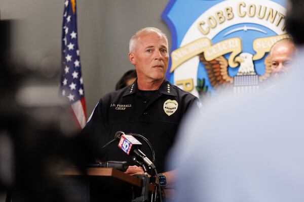 Cobb County Police Chief James Ferrell talks to reporters about how the county sheriff's office is deputizing county police officers so they can continue providing law enforcement services in the city of Mableton despite the absence of an agreement between the city and the county. (Estela Muñoz/AJC)