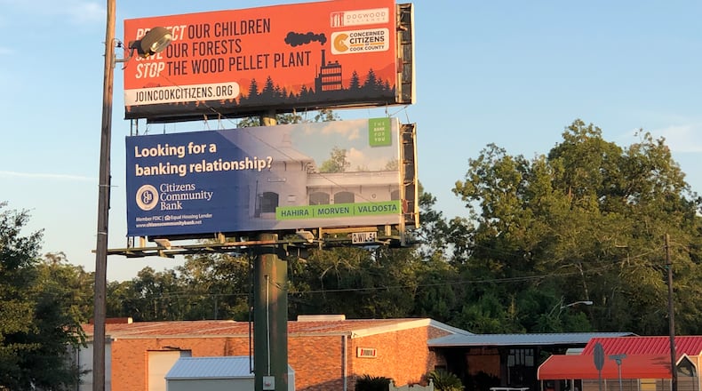 A billboard helps bring awareness to wood pellet plants slated for the city of Adel. Residents have filed a petition to appeal an air quality permit that would allow the world's largest wood pellet facility to open next to a predominantly Black and Hispanic neighborhood. COURTESY OF TREVA GEAR/CONCERNED CITIZENS OF COOK COUNTY