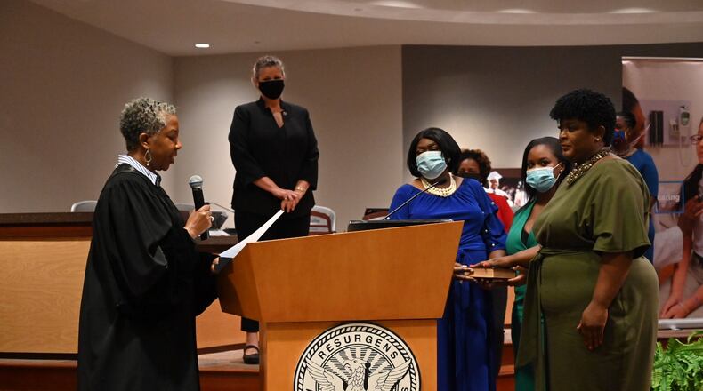 Lisa Herring, right, is sworn in as Atlanta Public Schools superintendent as Fulton County State Court Judge Patsy  Porter administers the oath on Wednesday, July 1, 2020. HYOSUB SHIN/AJC