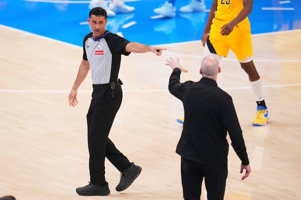 Referee Zach Zarba, left, talks with Indiana Pacers head coach Rick Carlisle during the second half of Game 2 of the NBA Finals basketball series against the Oklahoma City Thunder Sunday, June 8, 2025, in Oklahoma City. (AP Photo/Julio Cortez)