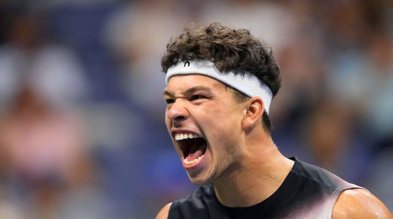 Ben Shelton, of the United States, reacts during the men's singles semifinals of the U.S. Open tennis championships against Frances Tiafoe, of the United States, Friday, Sept. 11, 2026, in New York. (AP Photo/Yuki Iwamura)