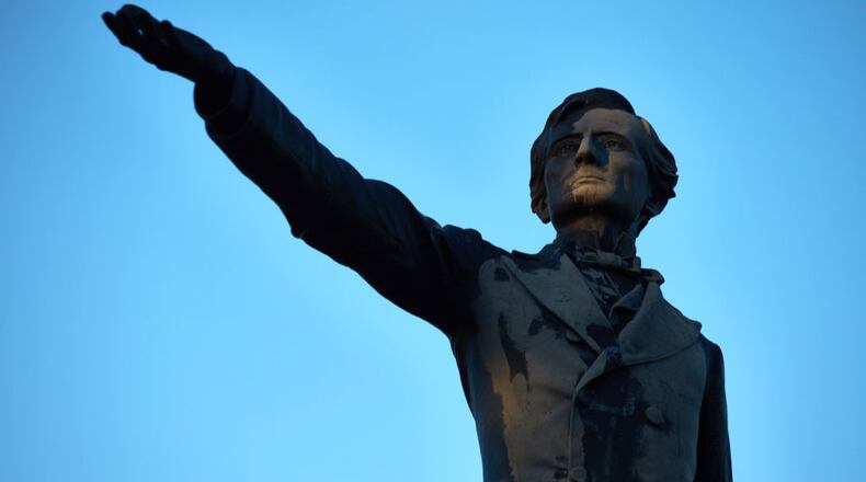 After a Confederate monument (not pictured) of Jefferson Davis was stolen from an Alabama cemetery last month, a group now claiming responsibility is threatening to turn the ornate sculpture of a chair into a toilet. (AJC file photo, courtesy of The Washington Post)