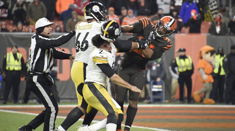 Quarterback Mason Rudolph of the Pittsburgh Steelers fights with defensive end Myles Garrett of the Cleveland Browns during the second half at FirstEnergy Stadium on Nov. 14, 2019, in Cleveland, Ohio.