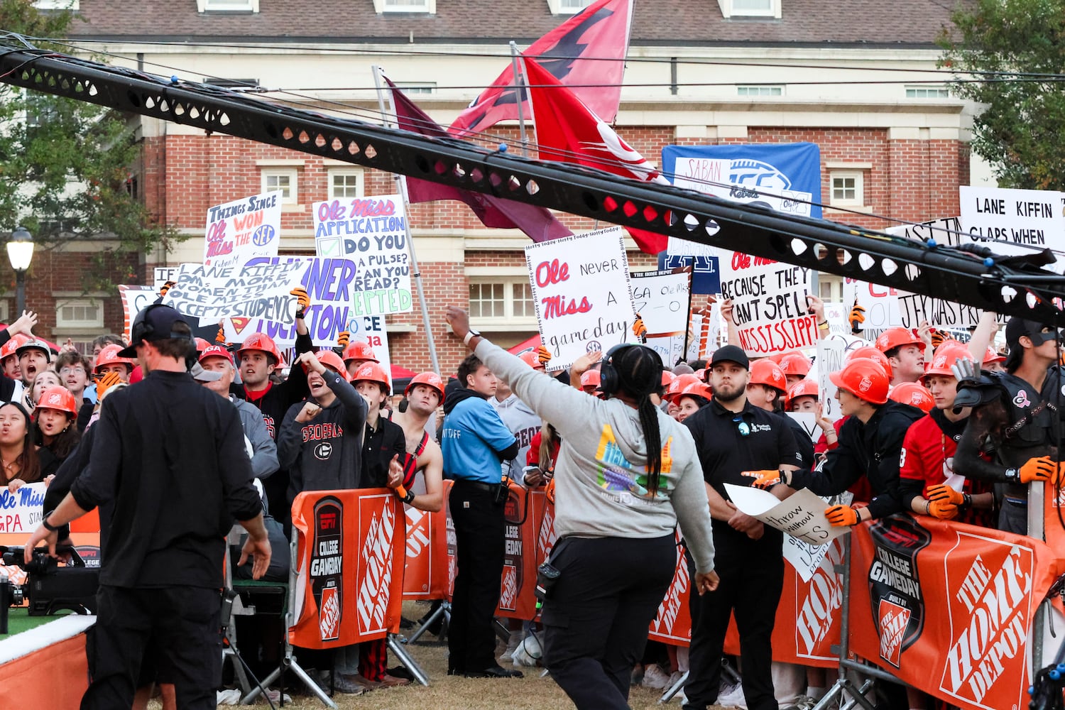 Crew members direct the crowd before the ESPN College GameDay broadcast from Myers Quad at UGA on Saturday, Oct. 18, 2025. (C.J. Bartunek for the AJC)
