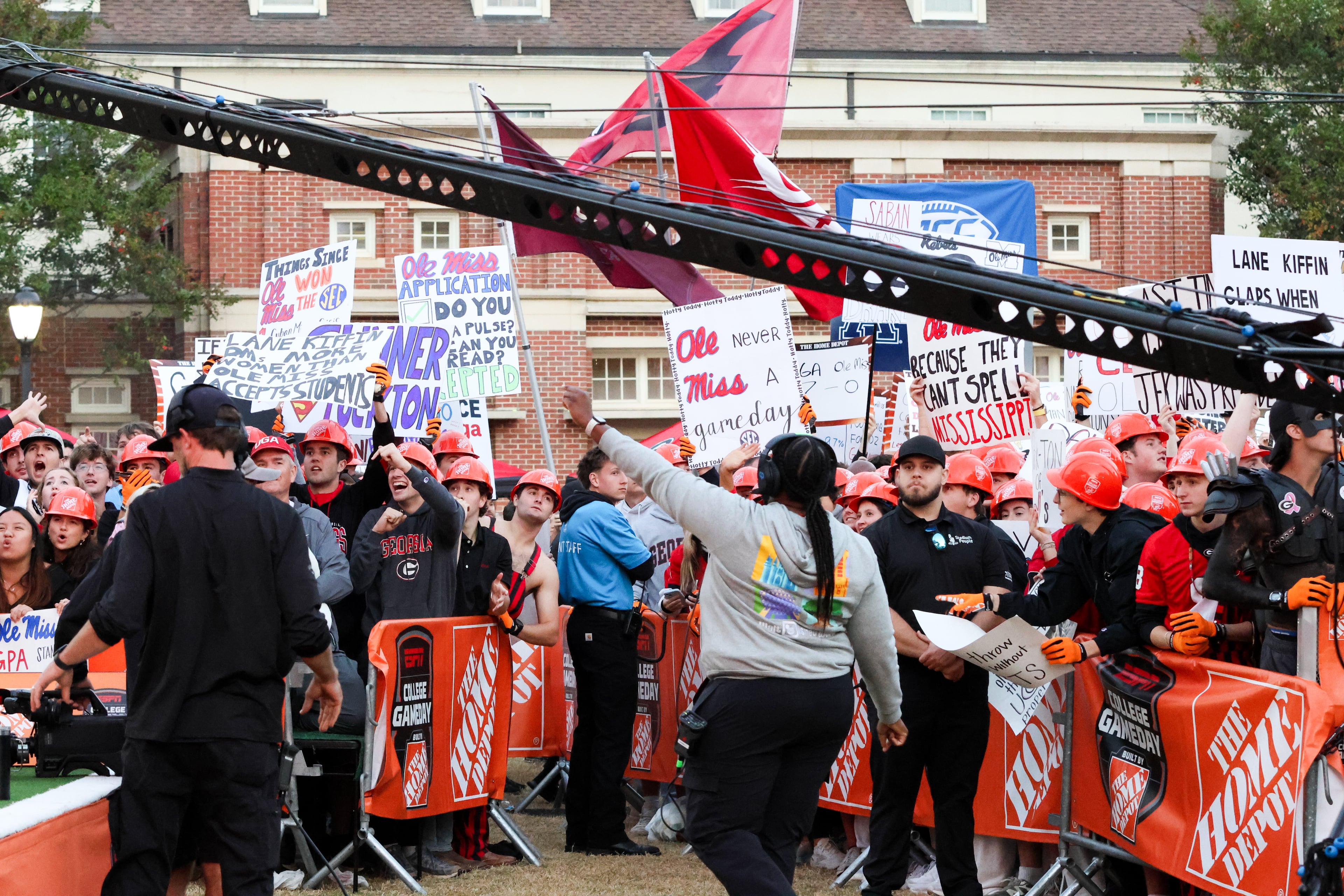 Crew members direct the crowd before the ESPN College GameDay broadcast from Myers Quad at UGA on Saturday, Oct. 18, 2025. (C.J. Bartunek for the AJC)