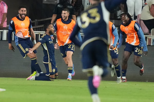 Vancouver Whitecaps midfielder Pedro Vite, second from left, celebrates after scoring a goal during the second half of a CONCACAF Champions Cup second-leg semifinal soccer match against Inter Miami, Wednesday, April 30, 2025, in Fort Lauderdale, Fla. (AP Photo/Lynne Sladky)