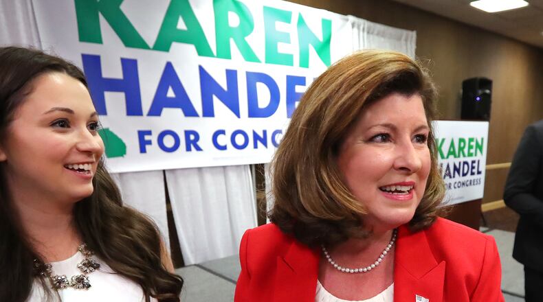 April 18, 2017, Roswell: Republican candidate Karen Handel arrives to work a room full of supporters during her election night viewing party in the special election for Georgia's 6th Congressional district at the Double Tree Hotel on Tuesday, April 18, 2017, in Roswell.  Curtis Compton/ccompton@ajc.com