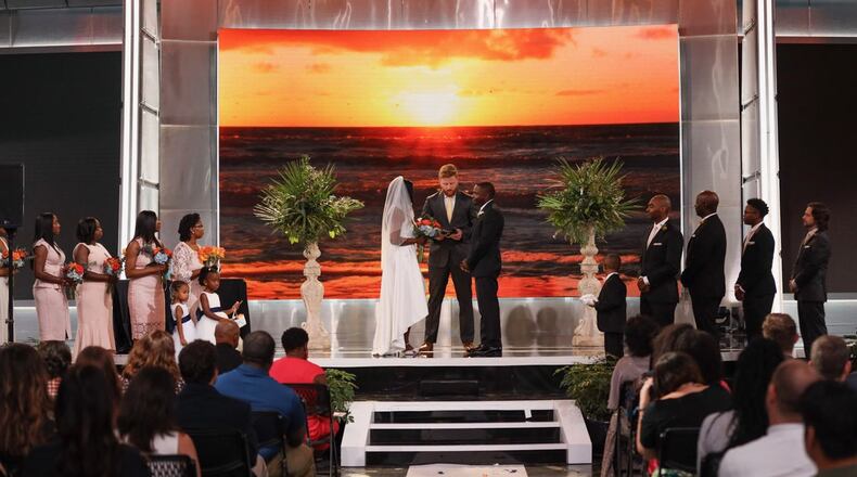 Hurricane Dorian forced this couple to cancel their wedding plans in Charleston. They got married at work, Turner Studios in Atlanta, instead on Friday, September 6, 2019. Colleagues replaced cameras with flowers, and the bridesmaids and groomsmen replaced the sports analysts. (D'Marcus Pulse/Turner Studios/contributed photo to AJC)