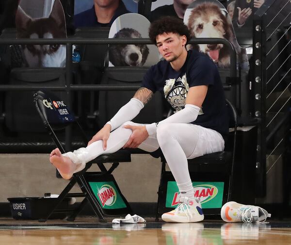 021421 Atlanta: Georgia Tech guard Jordan Usher watches the end of the game against Pittsburgh with his right ankel iced down after leaving the game with an injury in an NCAA college basketball game on Sunday, Feb 14, 2021, in Atlanta.      Curtis Compton / Curtis.Compton@ajc.com”