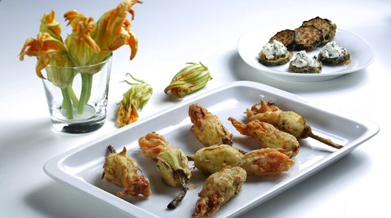 Fresh squash blossoms fill with ricotta cheese prepared and styled by Joan Moravek in the test kitchen on Wednesday, Aug. 1, 2018. (Abel Uribe/Chicago Tribune/TNS)